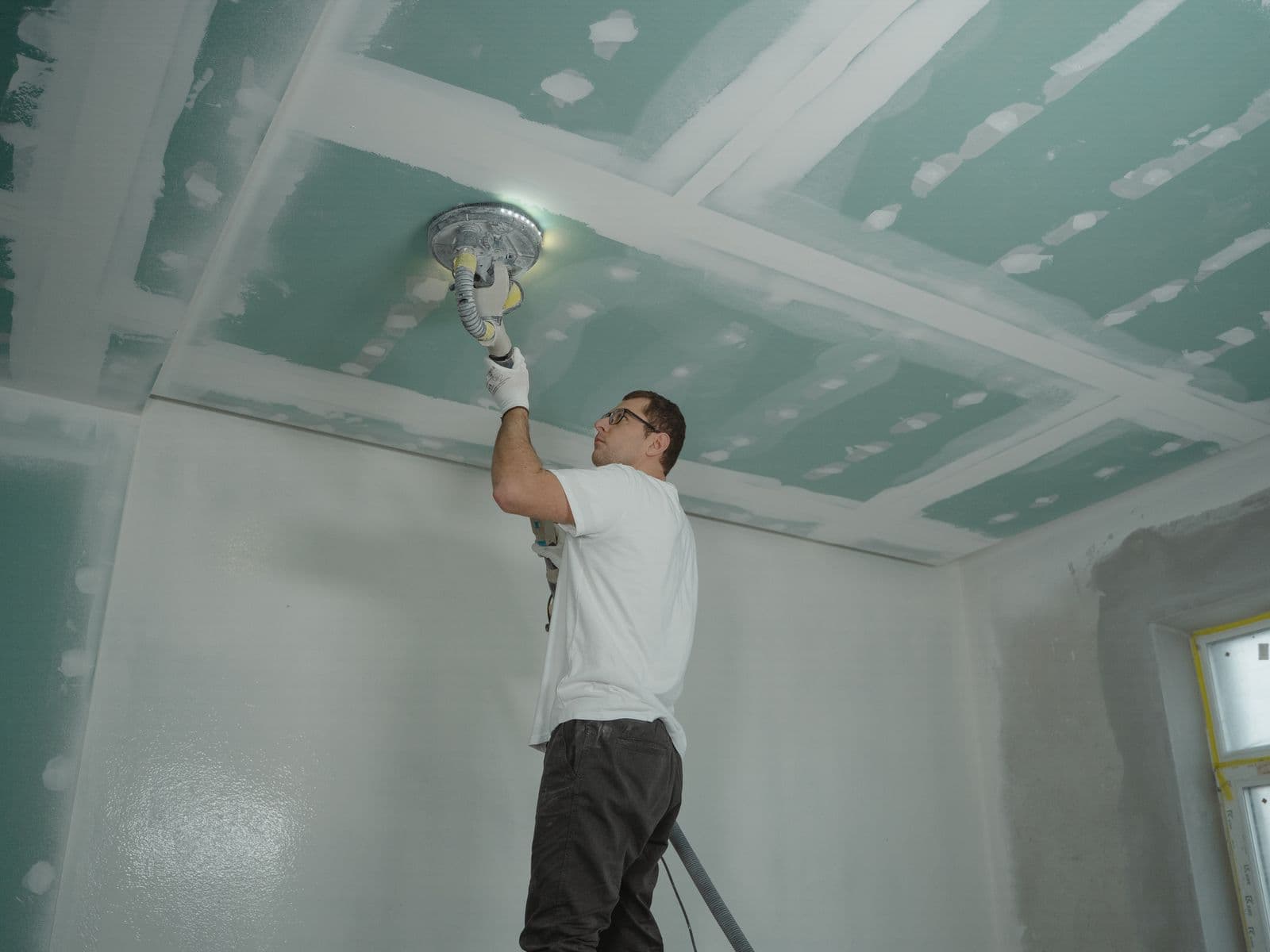 Sanding a drywall ceiling smooth