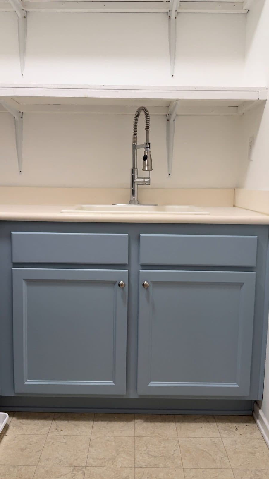 Laundry room cabinets refinished in blue gray