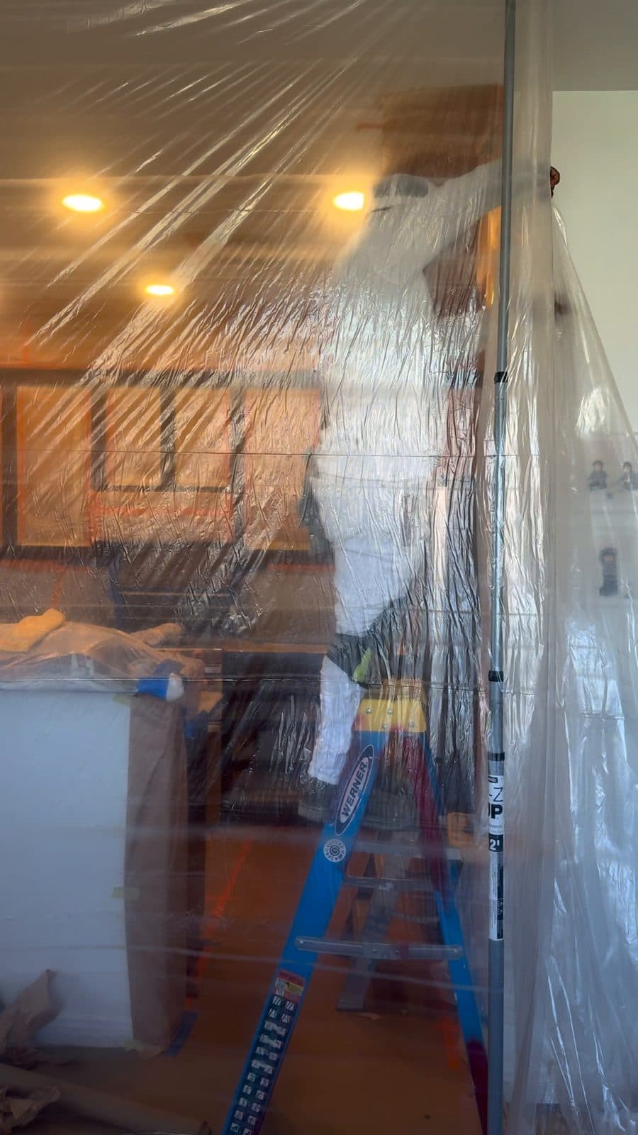 Zip wall and plastic containment set up before cabinet work