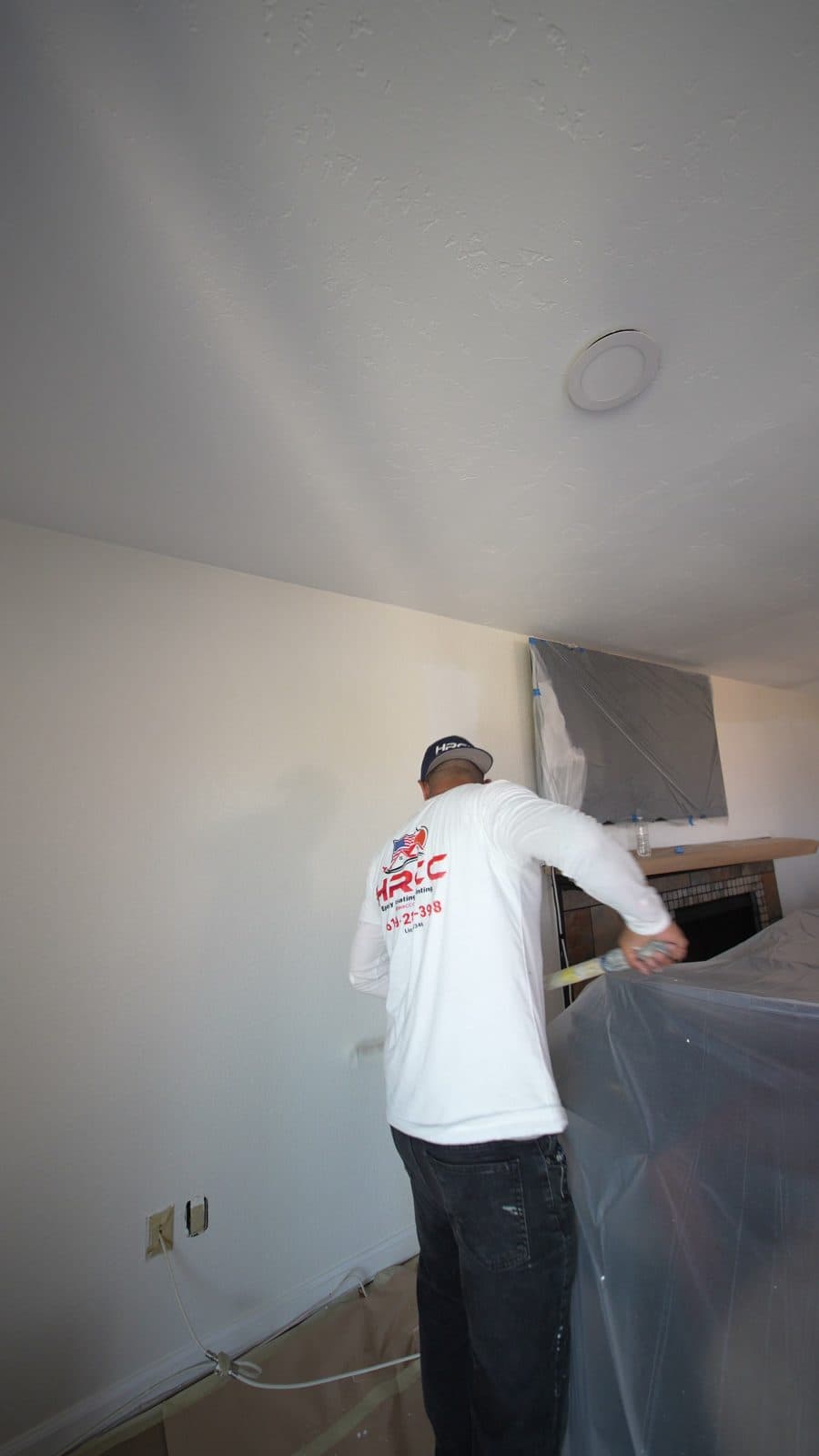 HRCCoatings crew rolling an interior wall in Spring Valley